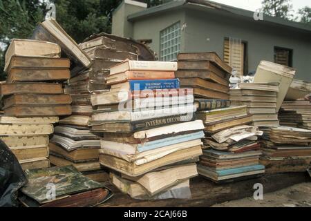 New Braunfels Texas USA, October 1998: Stacks of ruined books dry out on New Braunfels main street after the Guadalupe River flooded many homes and businesses. ©Bob Daemmrich Stock Photo