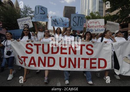 Austin, Texas USA, May 1, 2006: Thousands of immigrants and immigrant rights supporters march down Congress Avenue in downtown Austin Monday, part of a show of solidarity nationwide and protesting political reforms working their way through the U.S. Congress. National Day Without Immigrants protest and boycott. ©Bob Daemmrich Stock Photo