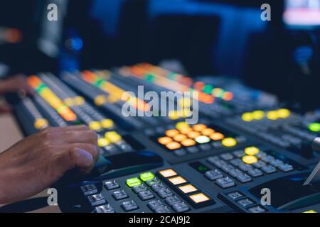 Controlled in a broadcast studio. Video mixer use Stock Photo