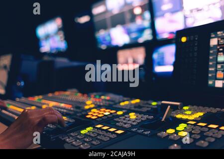 Controlled in a broadcast studio. Video mixer use Stock Photo