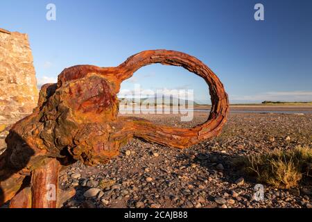 Old rusty anchor on the beach at Ravenglass, Lake District, England Stock Photo