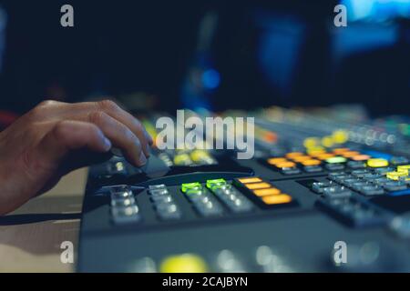 Controlled in a broadcast studio. Video mixer use Stock Photo