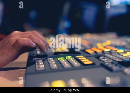 Controlled in a broadcast studio. Video mixer use Stock Photo