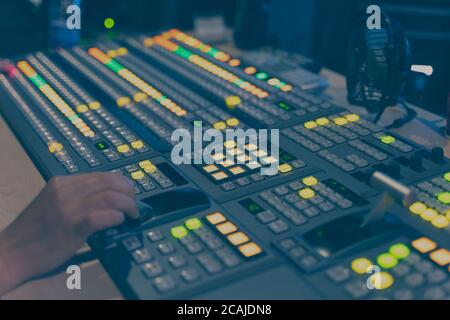 Controlled in a broadcast studio. Video mixer use Stock Photo