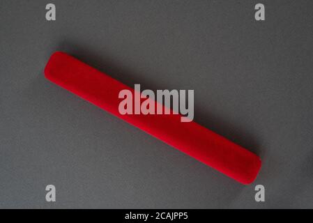 Red closed jewelry box on a black background. Top view Stock Photo