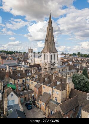 Aerial photography of the town centre of Stamford, Lincolnshire, UK. Showing a blue sky with clouds, pretty rooftops and many church spires. Stock Photo