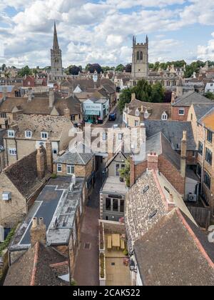 Aerial photography of the town centre of Stamford, Lincolnshire, UK. Showing a blue sky with clouds, pretty rooftops and many church spires. Stock Photo