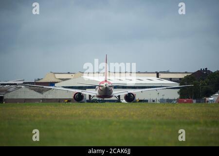 Glasgow, Scotland, UK. 7th Aug, 2020. Pictured: Air India Flight AI1133 from Mumbai which landed at Glasgow International Airport transporting a film crew and cast is seen returning today back to Mumbai. The plane is a Boeing 777-237(LR) aircraft. The film crew who landed last night are to be quarantined for 14 days before starting filming in Ayrshire later this month with Bollywood blockbuster, Bell Bottom, where it's reported the 80s' thriller revolves around a plane hijacking. Credit: Colin Fisher/Ģ����ý Live News Stock Photo