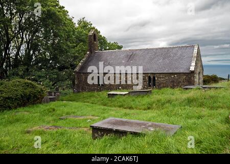 St Beuno's Church in Pistyll on the Llyn Peninsula, North Wales, dates from the 12th century.  It is now a Grade I listed building. Stock Photo