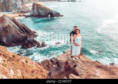 Pregnant couple posing on the Loiba cliffs in Galicia, Spain Stock Photo