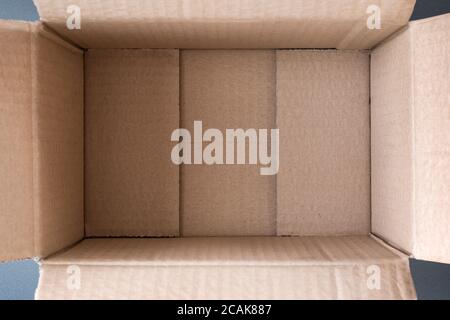 Empty open cardboard box, inside view. Close up Stock Photo