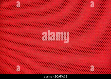 Smooth texture bright red mesh fabric. Stock Photo