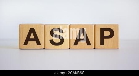 Wood block with acronym 'ASAP' - 'as soon as possible' on white background, copy space. Business concept. Stock Photo