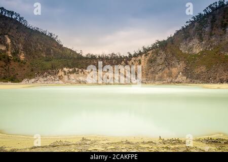 Long exposure of Kawah Putih volcanic sulphur lake inside the crater, Bandung, Indonesia Stock Photo