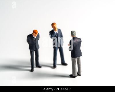 Selective focus of business figure or isolate background. The team leader discusses with the team for finding solution. Stock Photo