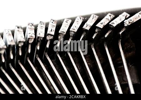 the iron hammers with the letters imprinted inside an old typewriter. Mechanical tools for writing. Old time journalism Stock Photo