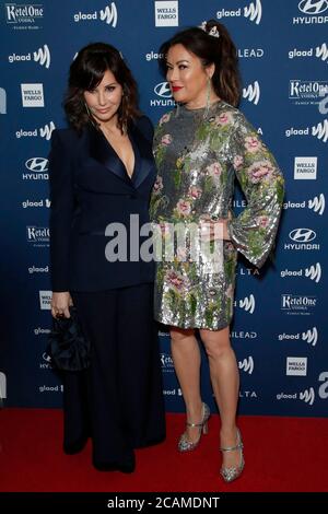 LOS ANGELES - MAR 28:  Gina Gershon, Jennifer Tilly at the 30th Annual GLAAD Media Awards at the Beverly Hilton Hotel on March 28, 2019 in Los Angeles, CA Stock Photo