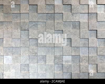 A close up of a square shaped brick wall Stock Photo