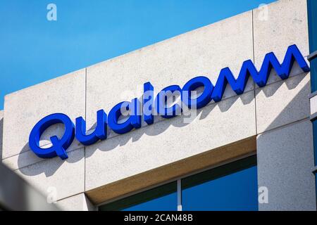 Close up. Qualcomm logo atop company office. Qualcomm Incorporated is an American multinational semiconductor and telecommunications equipment company Stock Photo