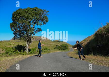 two boys playing in wide area of vagamon Stock Photo