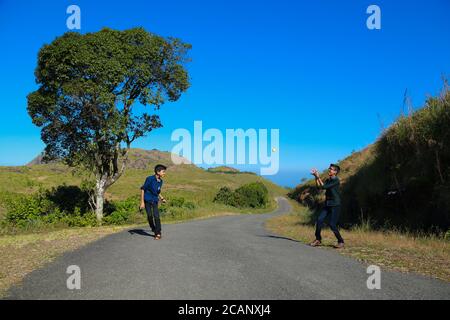 two boys playing in wide area of vagamon Stock Photo