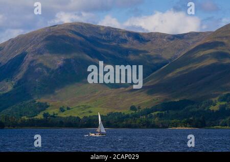 A 25ft yacht makes it's way up Loch Linnhe towards Fort William on the the west coast of Scotland UK Stock Photo
