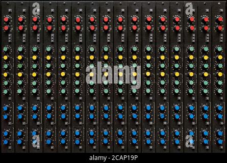Backgroungs and textures: antique sound mixing console, set of knobs, buttons and sliders Stock Photo