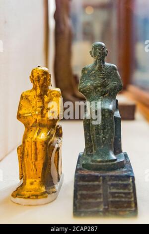 Egypt, Cairo, Egyptian Museum, statue of the god Ptah, seated on a throne, on top of stairs. In breccia stone. Originally enveloped into a gold foil. Stock Photo