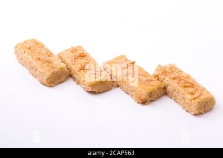 Kaasstengels or Kastengel  Kue Keju or Dutch Indonesian cheese stick cookies isolated on white background Stock Photo