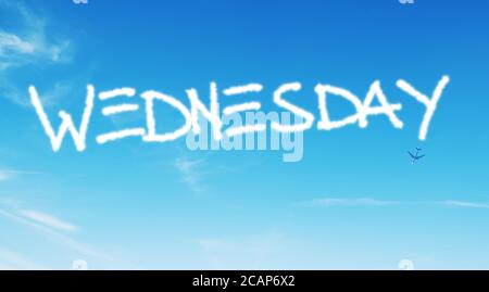 wednesday written in the sky with contrails Stock Photo