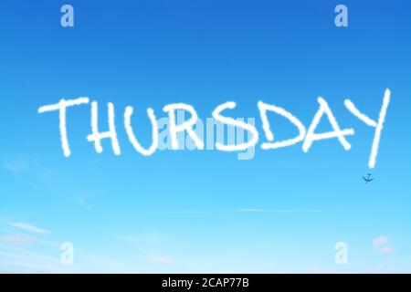 thursday written in the sky with contrails Stock Photo