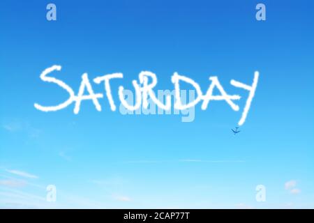saturday written in the sky with contrails Stock Photo