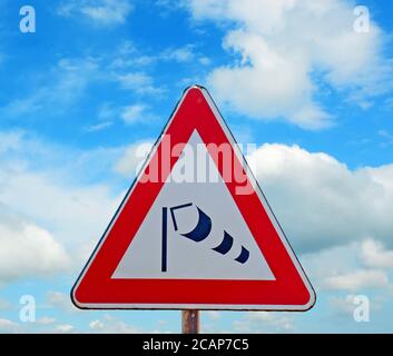 wind sock sign under a blue sky with clouds Stock Photo - Alamy