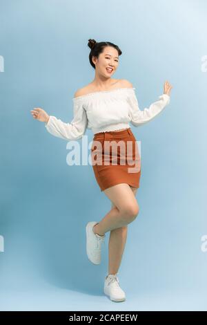 Full length body size view of nice attractive lovely girlish cheerful posing having fun isolated on bright color background Stock Photo
