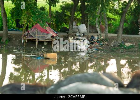 The people there are very poor and don't have many resources to build their homes. Many of them are made out of bamboo as the one in this picture. Stock Photo