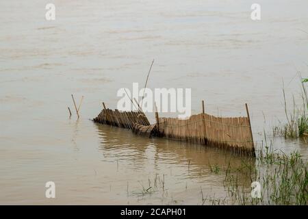 Bamboo fish-trap with a narrow neck - Bangladeshi traditional fishery tool Stock Photo