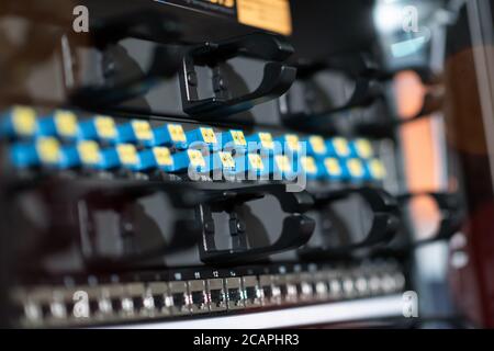 Hosting platform for modern Internet resources. Rack with server data storage equipment. Many network cables are connected to the data center equipmen Stock Photo
