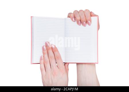 Open blank notebook in female hands. Place for text. White background, isolate Stock Photo