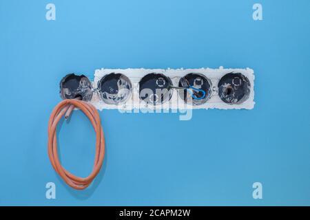 Installation of electrical outlets in the wall in the room. High quality photo Stock Photo