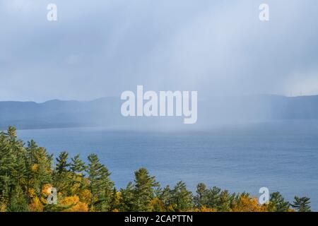 Autumn colour and squall clouds over Agawa Bay, Lake Superior Provincial Park, Ontario, Canada Stock Photo