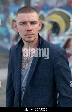 Portrait of a bully man in a blue jacket Stock Photo