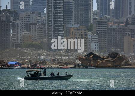 Beirut, Lebanon. 08th Aug, 2020. A Lebanese army speed boat sails in front of the explosion site at Beirut's port after a massive explosion that rocked Beirut on Tuesday. Credit: Marwan Naamani/dpa/Alamy Live News Stock Photo