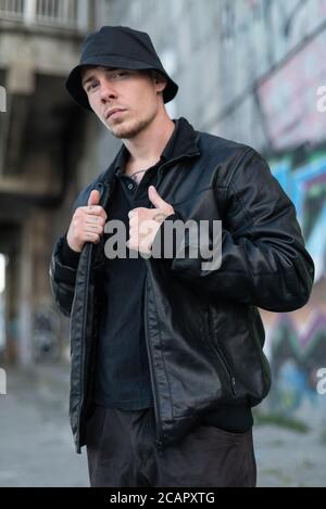 Bully criminal in black leather jacket Stock Photo