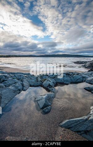 Dawn skies over the mouth of the Michipicoten River, Wawa, Ontario, Canada Stock Photo