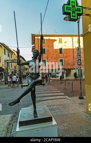 swingin woman statue in the city of Pietrasanta in Italy Stock Photo