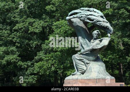 Warsaw Poland statue of Polish composer Frederyk Chopin in the Lazienki Park gardens in summer 2020 Stock Photo