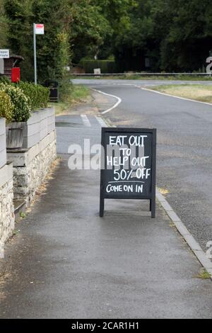 Eat Out to Help Out 50% off sign outside The Hen and Chicken roadside coaching inn, Alton, Surrey, UK, August 2020 Stock Photo