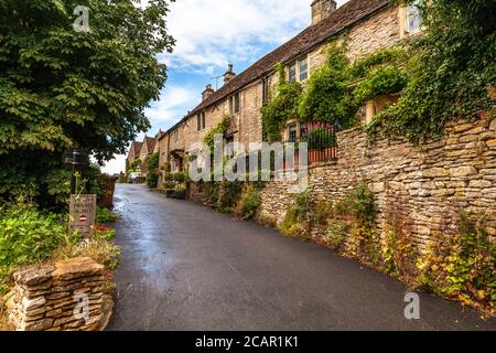A road between famous honeycomb cottages in the countryside village of Castle Combe in Cotswolds, UK Stock Photo