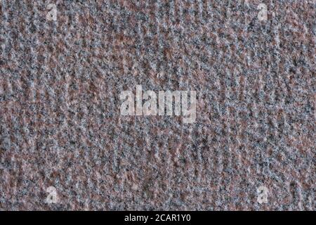 Roughly processed granite slab. Top view. Backgrounds and textures. Close up. Stock Photo