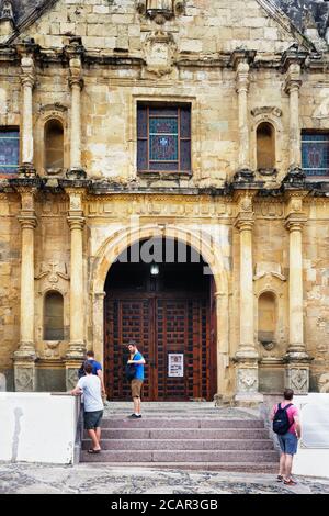 Tourists by the wooden doors at the entrance to the Metropolitan Cathedral  in the Old Town of Panama City, Panama, Central America Stock Photo